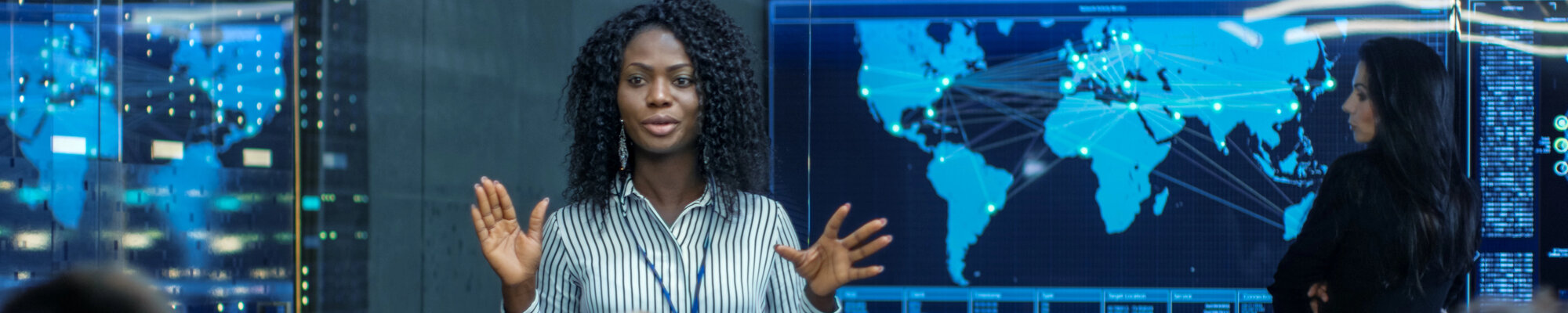 Female Chief Project Engineer Holds Briefing for a Team of Scientists building a machine learning system.